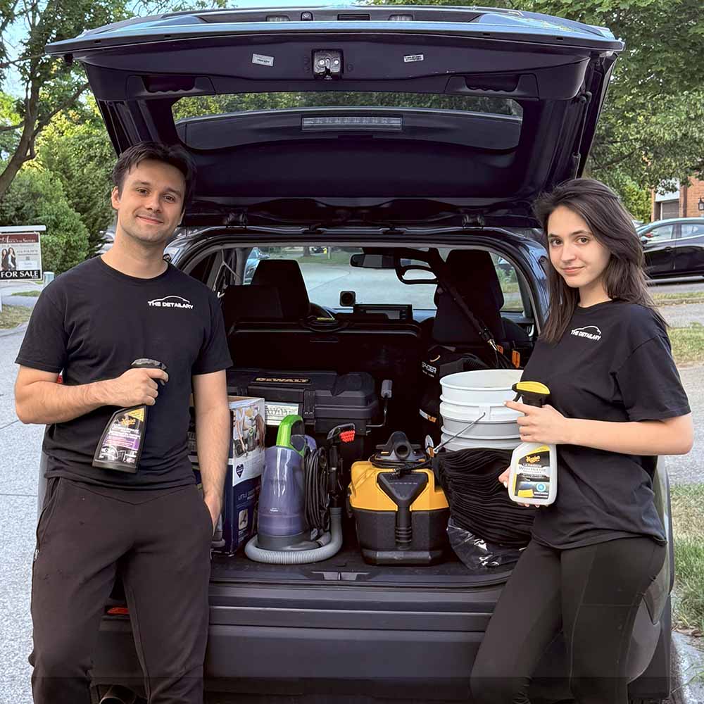 Founder and co-founder of The Detailary stand in front of their mobile car detailing equipment in Etobicoke.